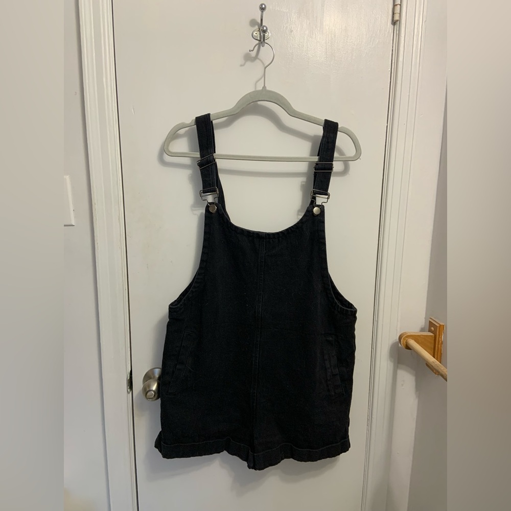 Black shorteralls with pockets.
